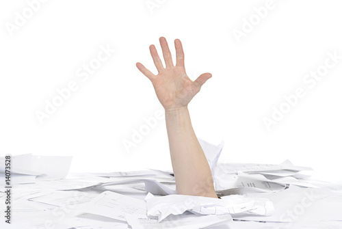 hand drowning in paper work