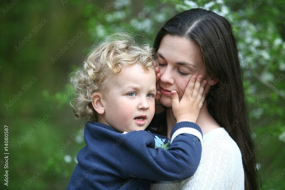 Kid on mothers hands.