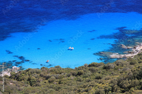 Gommoni in ormeggio nelle azzurre acque della Sardegna photo