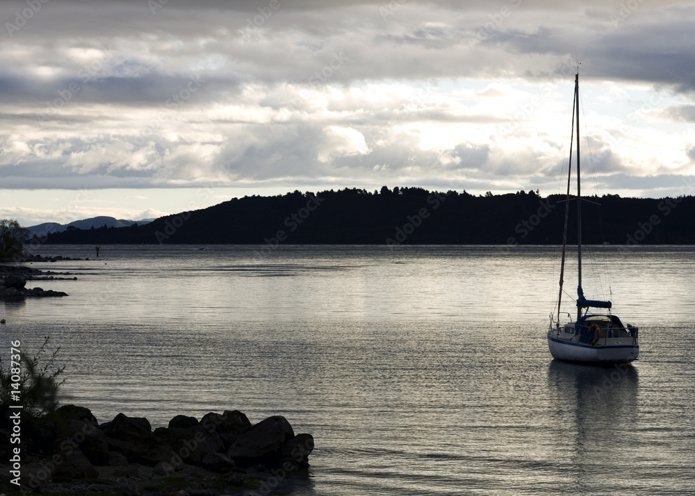 Sail Boat in Water at Dusk