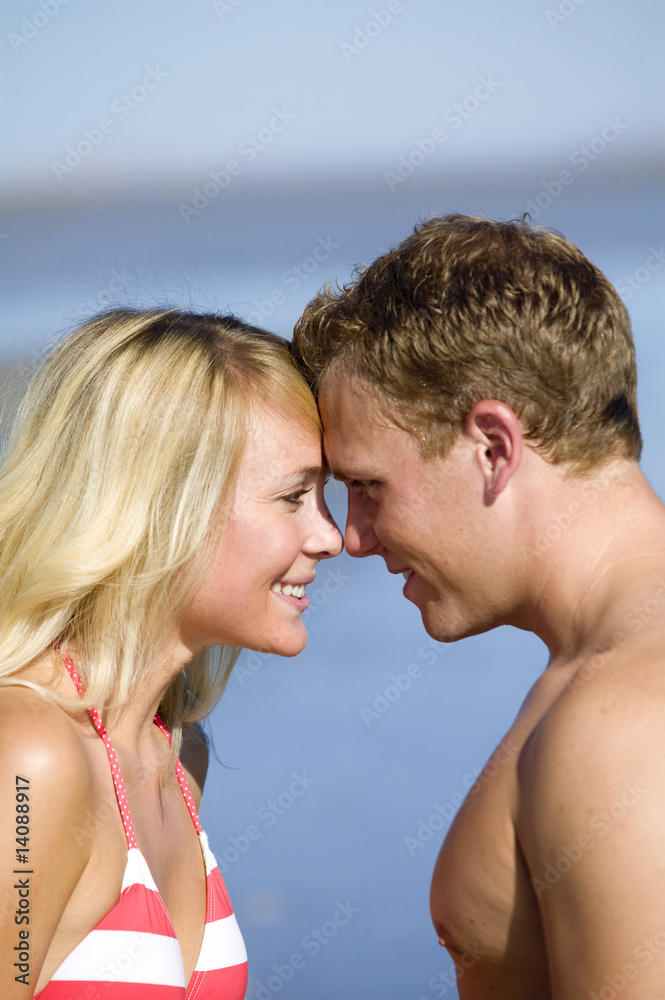 A young couple in love on the beach A young couple in love on the beach