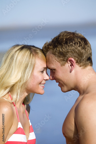 A young couple in love on the beach