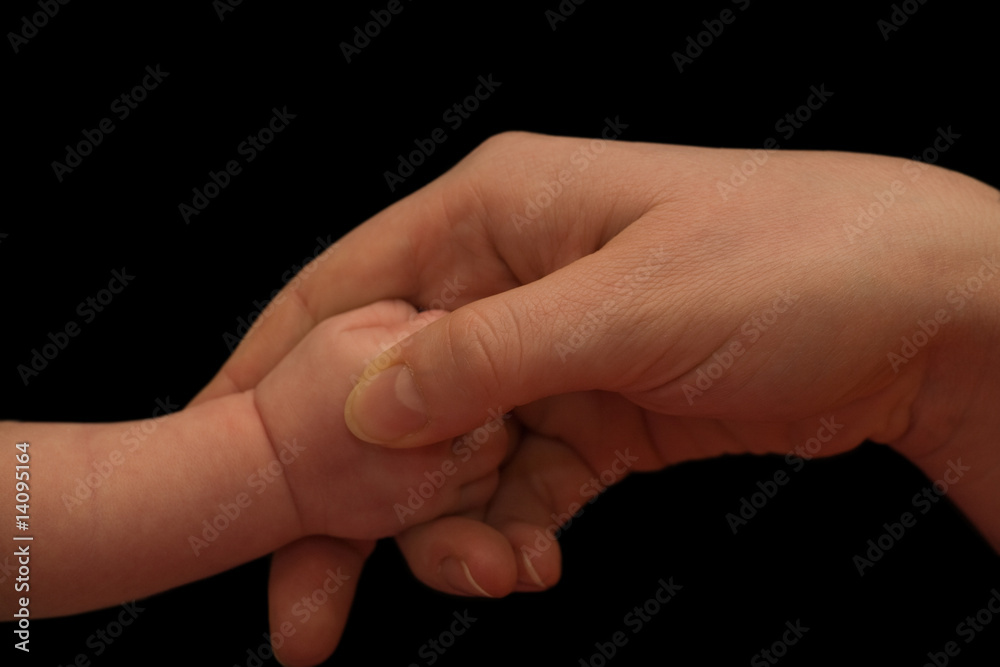 mother and baby hands on black mother and baby hands on black