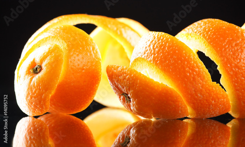 Spiral orange peel reflecting on black background