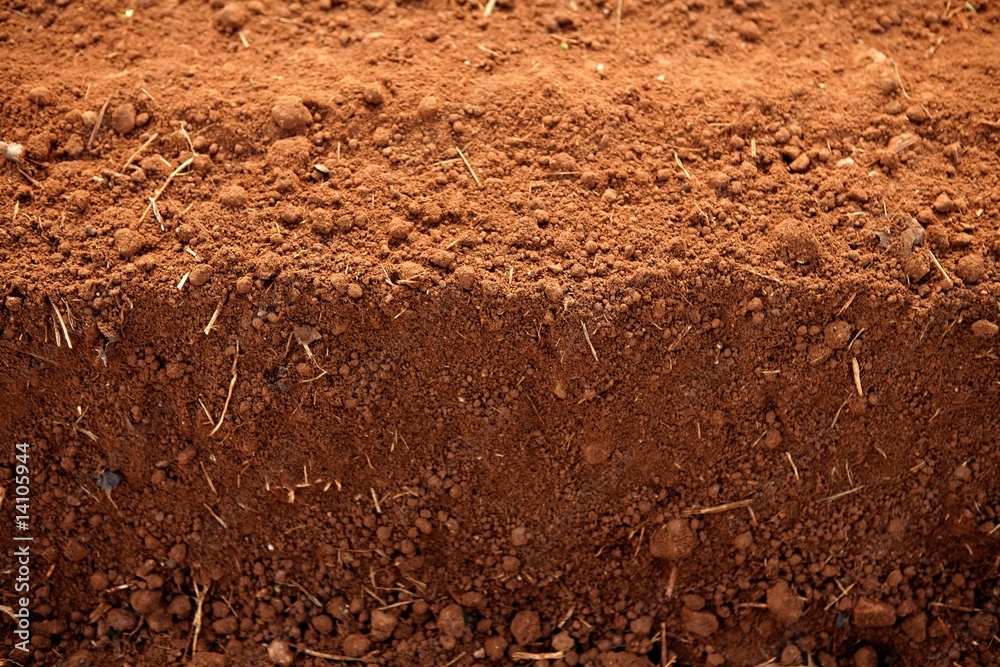 Ploughed red clay soil agriculture fields