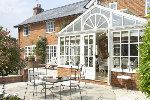 Exterior Of House With Conservatory And Patio