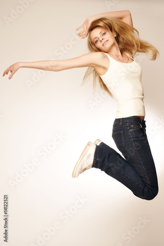 beautiful young blond in a jump photo