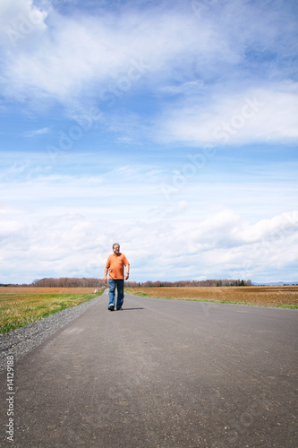 Man walking on a desert road