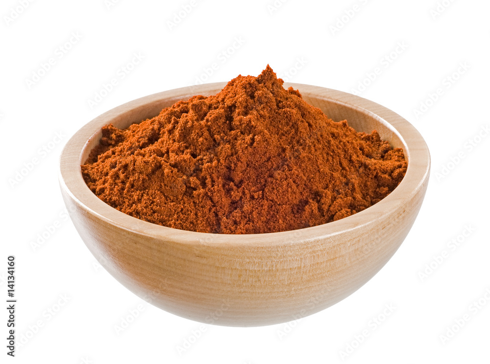Ground paprika in a wooden bowl Ground paprika in a wooden bowl