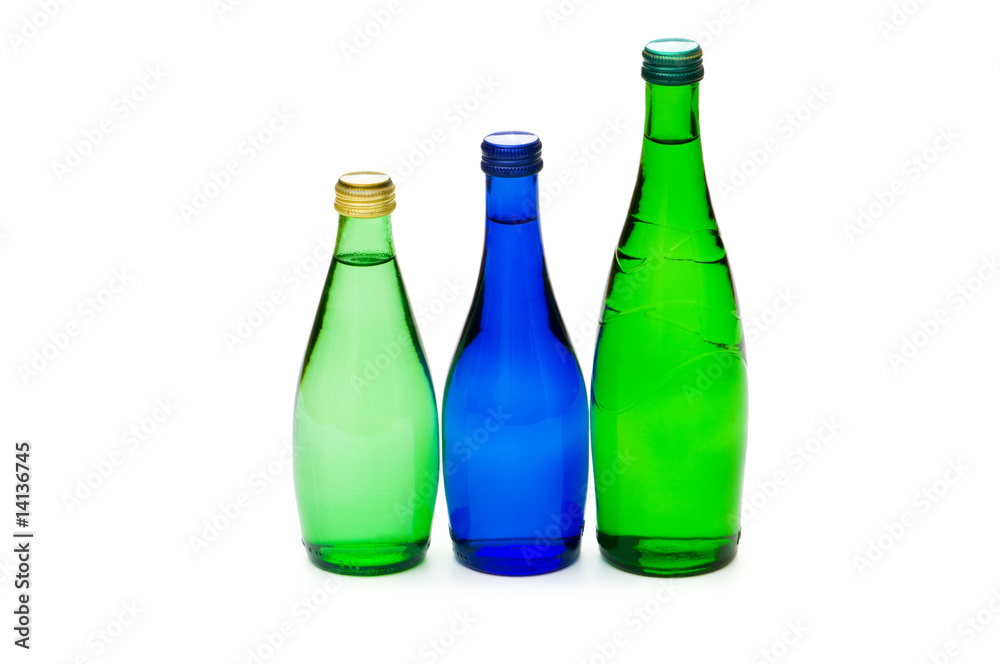 Bottles of water isolated on the white Bottles of water isolated on the white