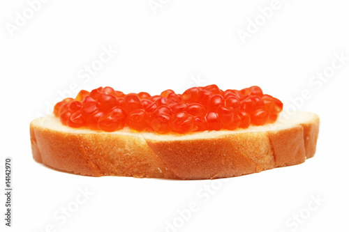 Sandwich with  red caviar isolated on white.