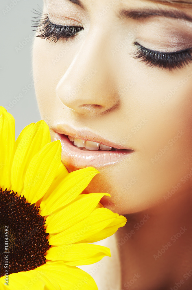 Beautiful woman with a sunflower Beautiful woman with a sunflower