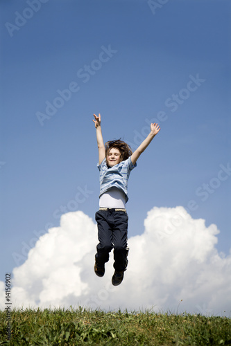 jump of child on the sky background