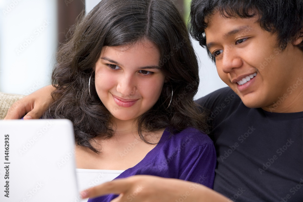 Teenager watching something on laptop Teenager watching something on laptop