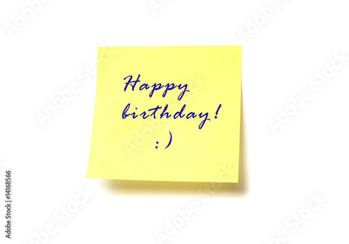 Yellow post it with words "Happy birthday!" isolated on white