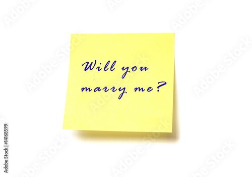 Yellow post it with words "Will you marry me?" isolated on white