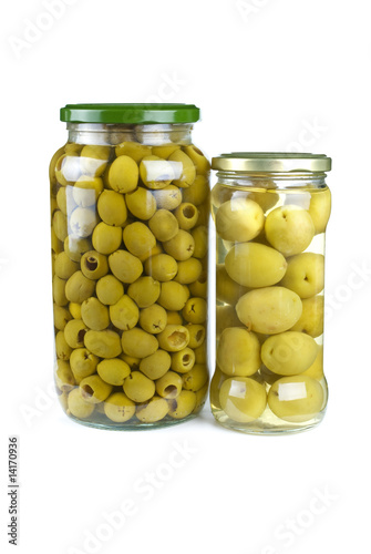 Glass jars with pitted and giant green olives