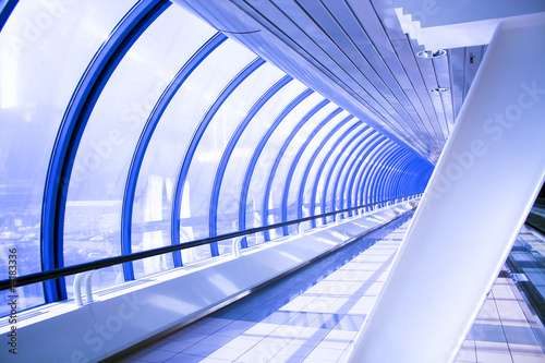 Blue glass corridor in tube