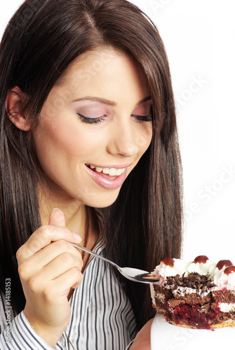 Business woman eating piece of cake.