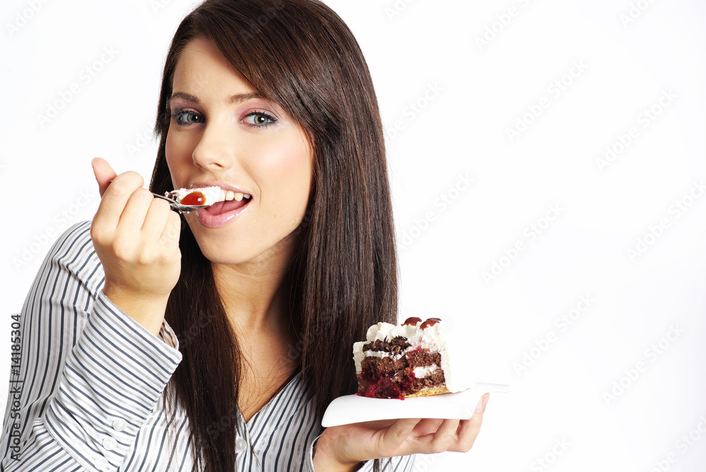 Business woman eating piece of cake. Business woman eating piece of cake.
