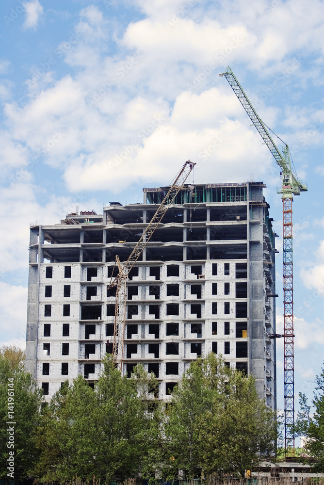 Residential building construction with crane and sky Residential building construction with crane and sky