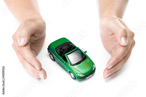 woman hands holding green car isolated on white background
