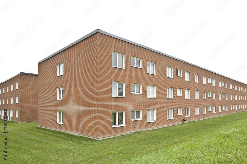 Obraz premium Brick wall building on a cloudy day