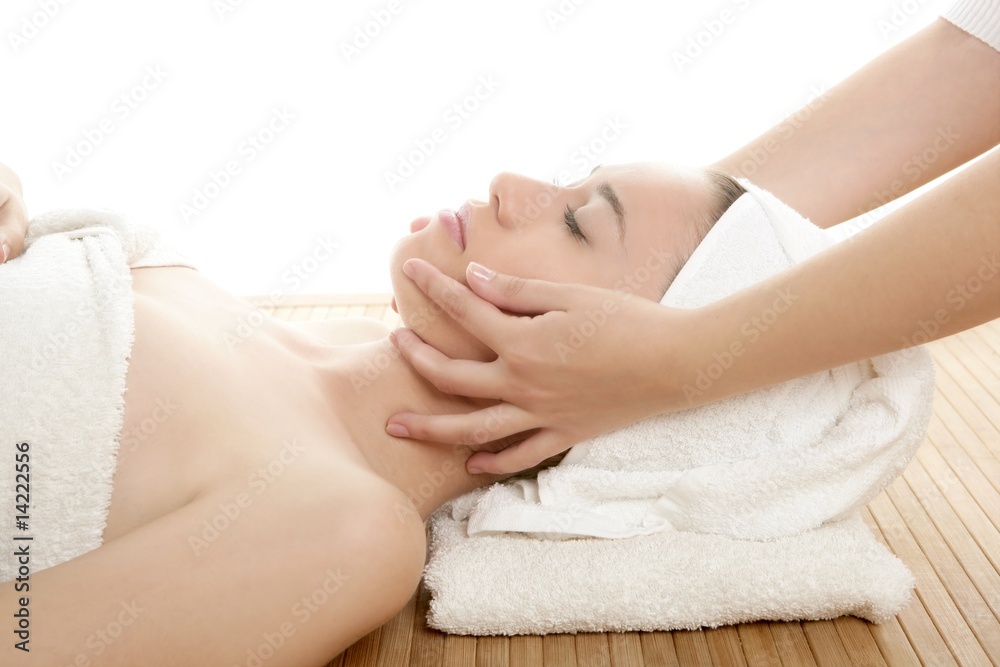 Beautiful woman face massage with white towel Beautiful woman face massage with white towel