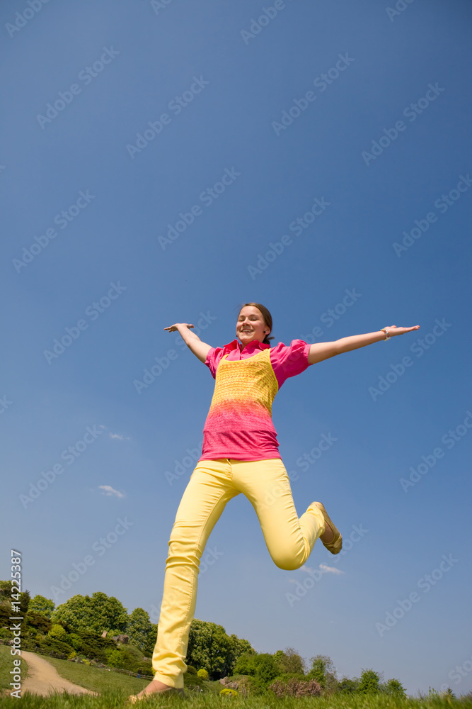 Happy smiling girl - jumping