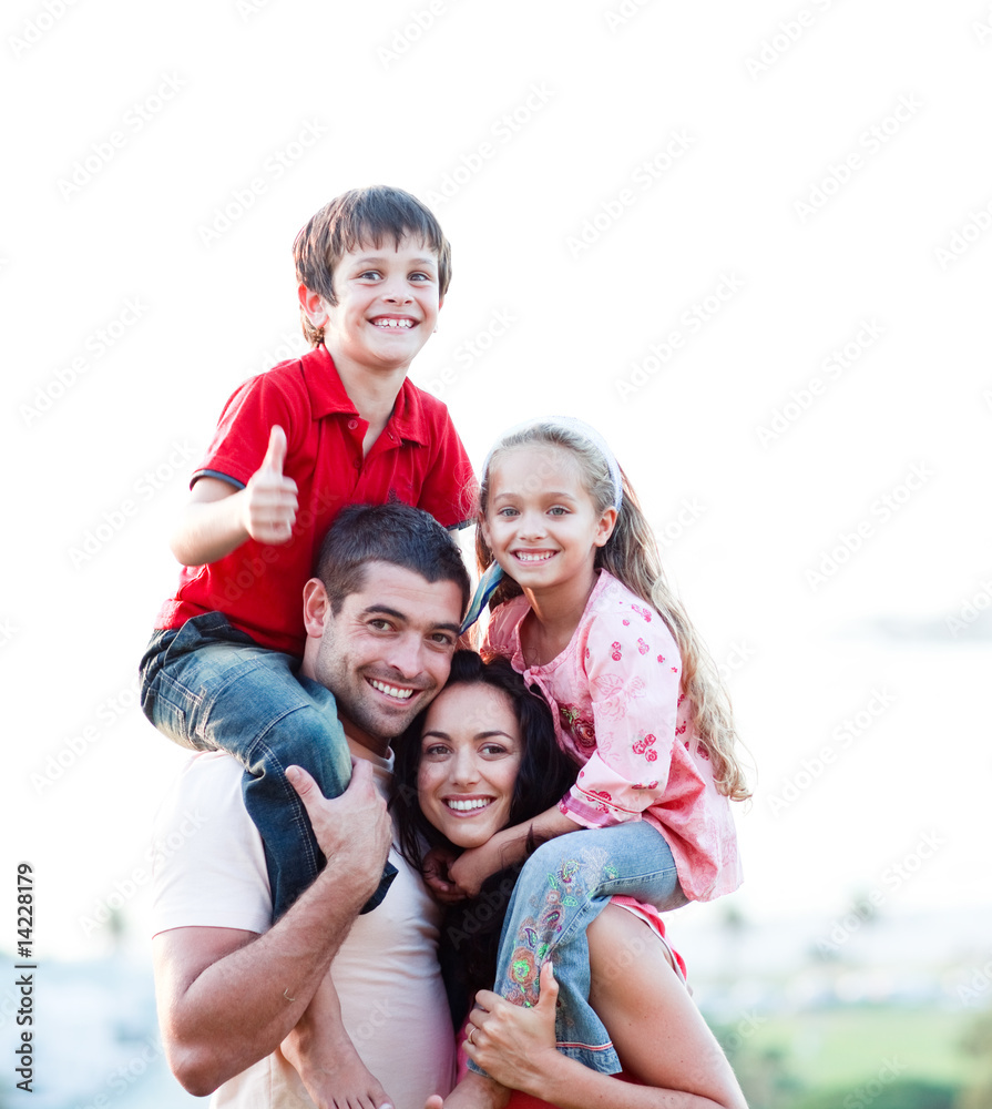 Parents giving children piggyback rides