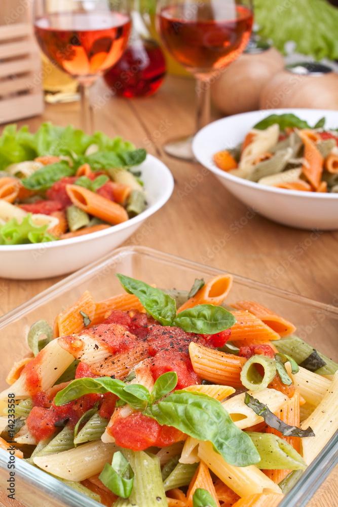 servings of colored penne pasta servings of colored penne pasta