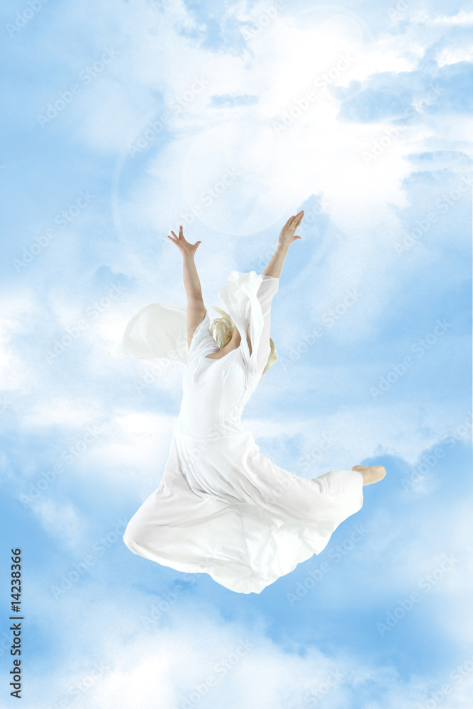 Beautiful young woman jumping in sky Beautiful young woman jumping in sky