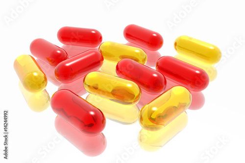red and yellow pills on white background