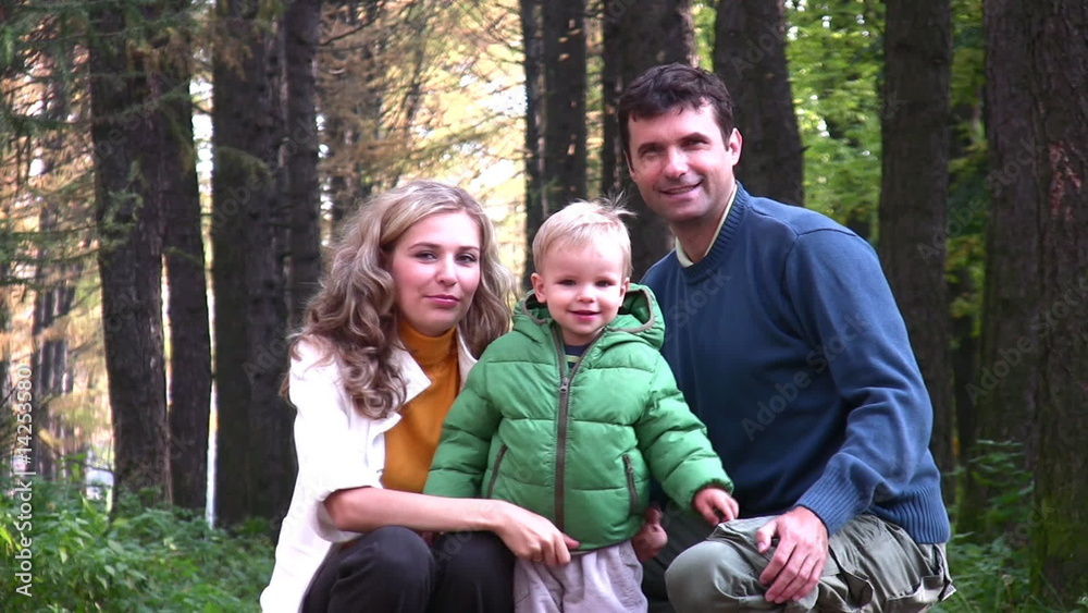 parents with boy in park parents with boy in park