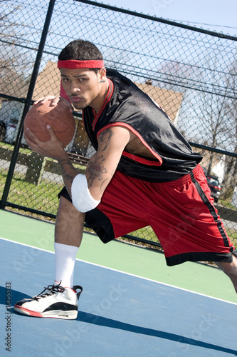 Basketball Player Dribbling photo