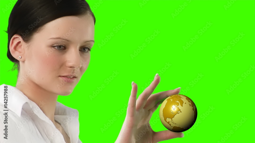 Brunette businesswoman holding a globe with a hand Brunette businesswoman holding a globe with a hand
