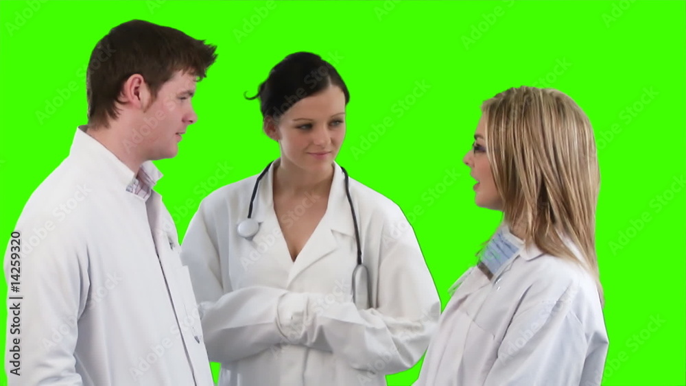 Group of doctors talking against green screen