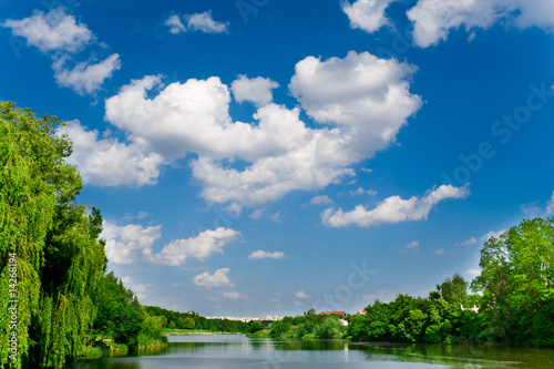 blue sky with clouds over river