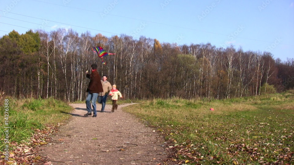 son, father and grandfather running with kite son, father and grandfather running with kite