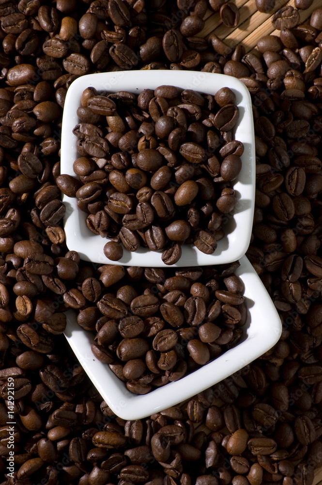 Fototapeta premium Two square bowls full of coffee beans, view from above