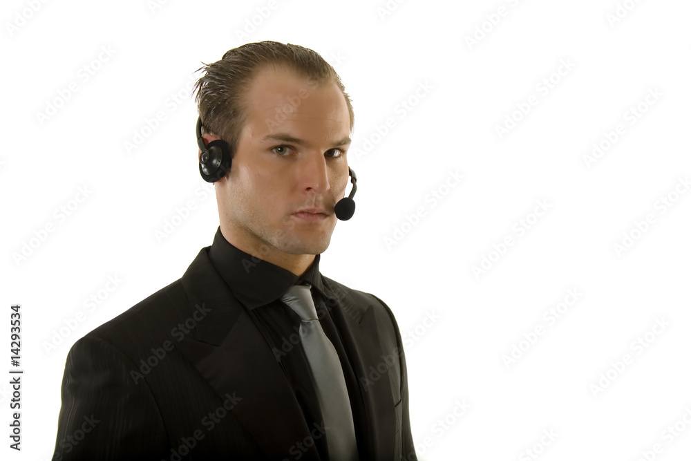 Successful young businessman wearing headphones Successful young businessman wearing headphones