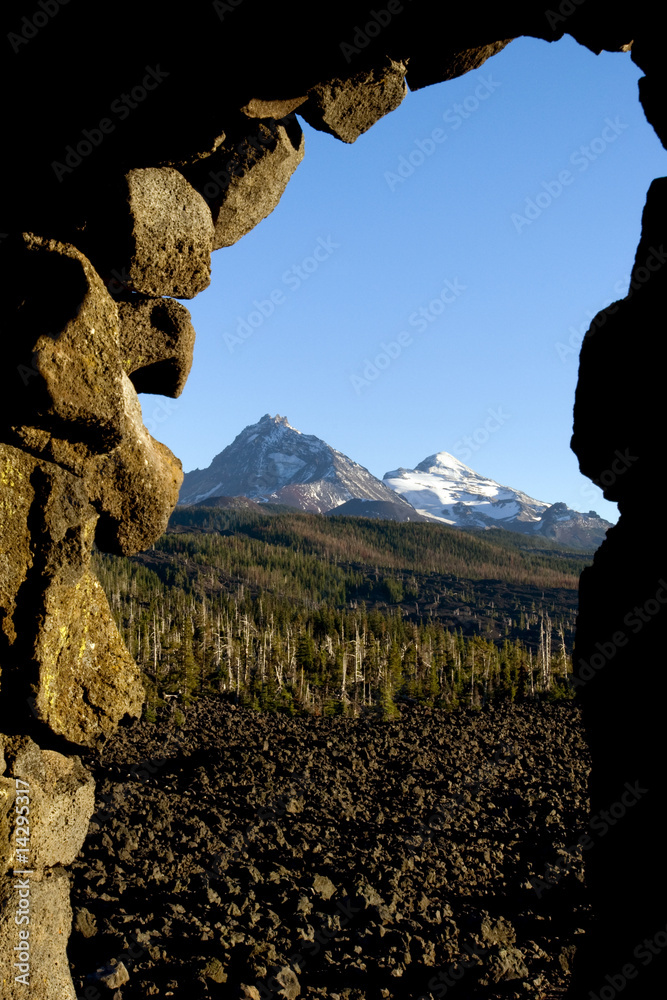 View of lava fields and Cascade peaks through observatory on McKenzie
