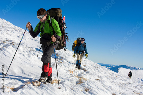 Hiker in winter in mountains