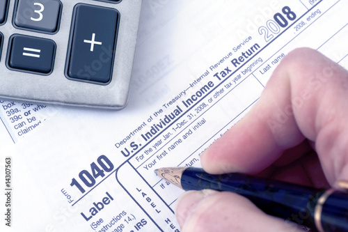 1040 Tax form with pen