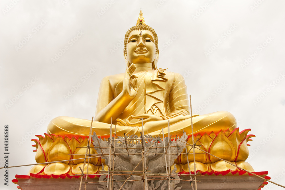 Fototapeta premium Big gold color Buddha image under construction