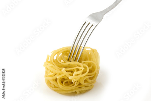 Uncooked pasta whith fork