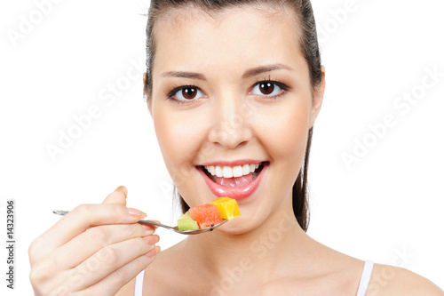 Beauty girl eating fruits