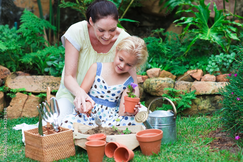 Mother and daughter gardening Mother and daughter gardening