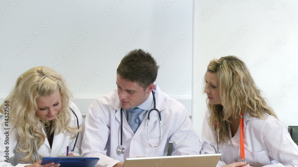 Three young doctors working together Three young doctors working together
