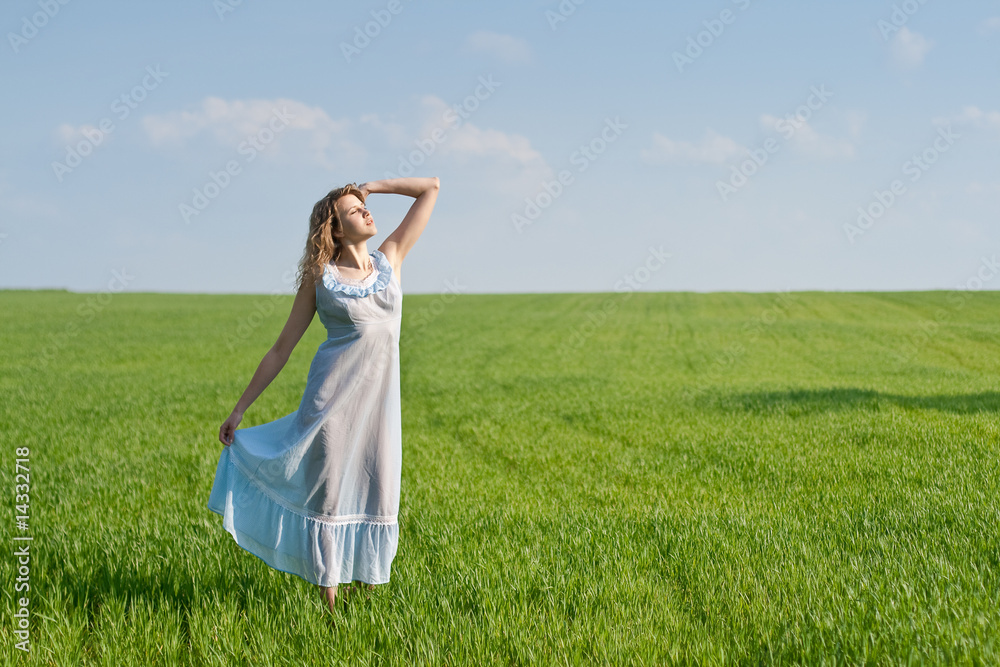 Young woman in nightdress on green meadow Young woman in nightdress on green meadow